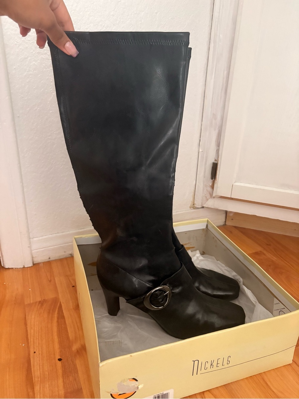 Nickels Black Leather Knee-High Heeled Boots with Buckle Accent
